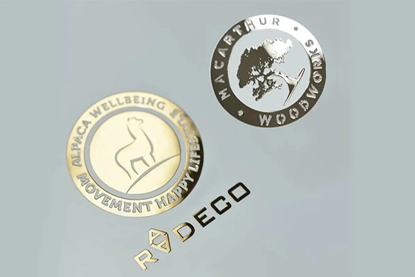 Thin metal sticker applied to consumer and electronic products for branding
