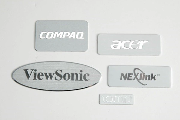 Stainless steel, aluminum and brass sample plates showing different alloy finishes