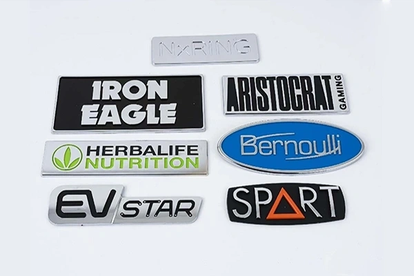 Custom metal emblems and 3D badges for automotive and product branding